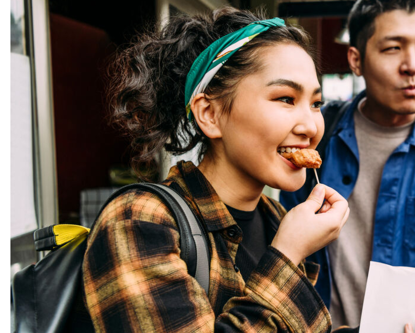 Woman taking a bite of food